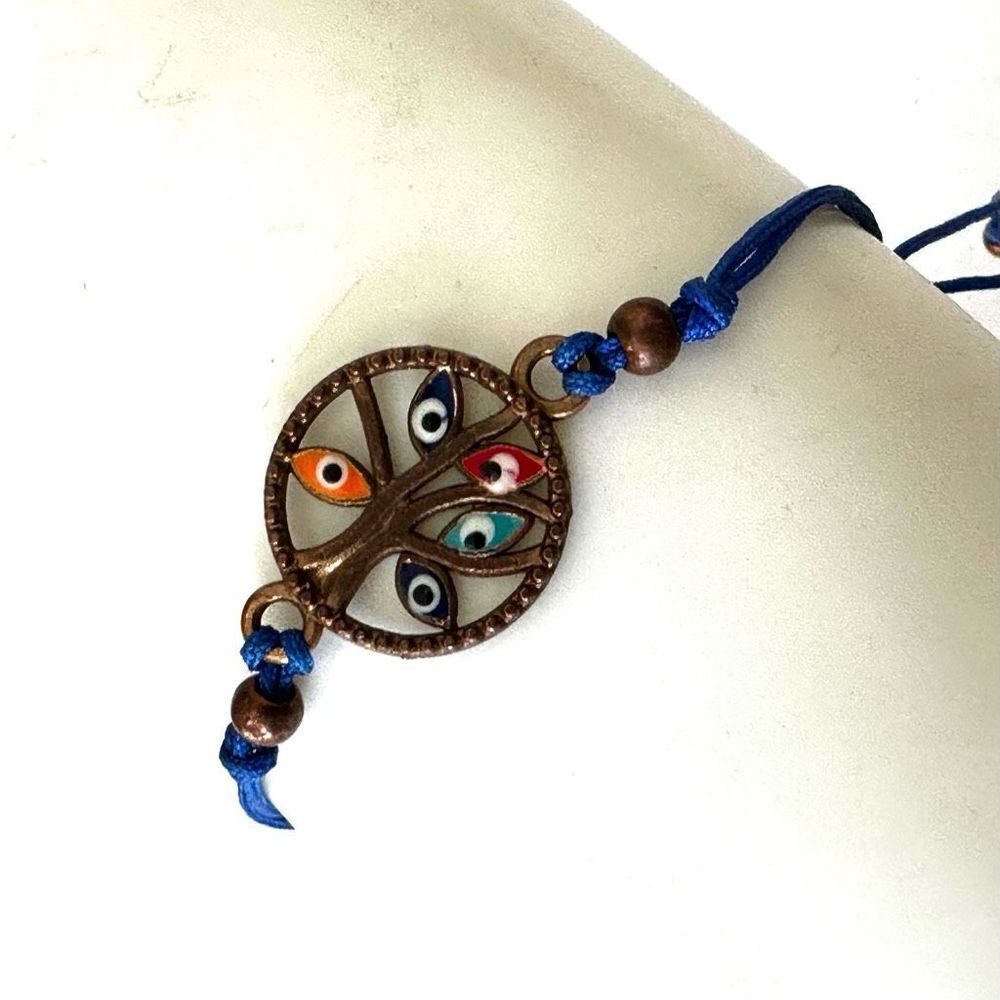 Evil eye tree charm bracelet on blue cord